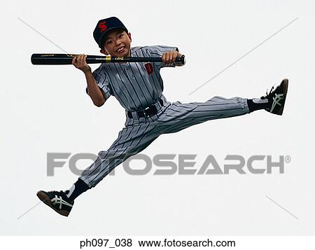 Stock Photo - Young Baseball player holding bat in mid-air. Fotosearch