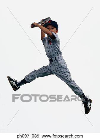 Stock Photography - Young Baseball player holding bat in mid-air. Fotosearch