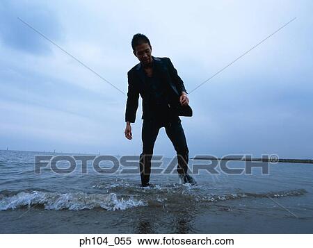 Injured man at the beach View Large Photo Image Stock Photography - Injured man at the beach. Fotosearch