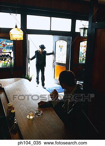 Man entering a bar, another man looking at him View Large Photo Image Stock Photography - Man entering a bar, another man looking at him. Fotosearch