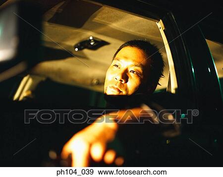 Stock Photo - Man in passenger seat, close-up. Fotosearch