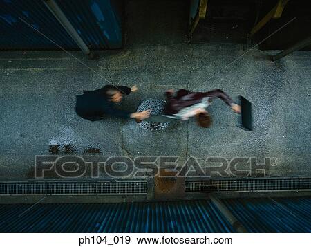 Two men struggling, one with a briefcase in his hand View Large Photo Image Stock Photo - Two men struggling, one with a briefcase in his hand. Fotosearch