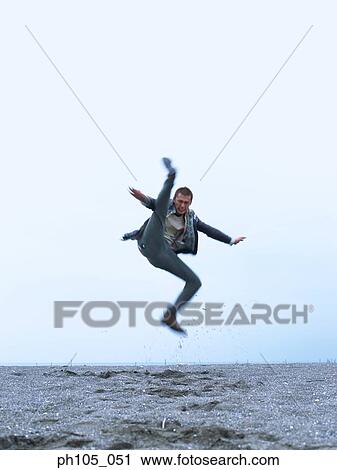 Man kicking in the air View Large Photo Image Stock Image - Man kicking in the air. Fotosearch