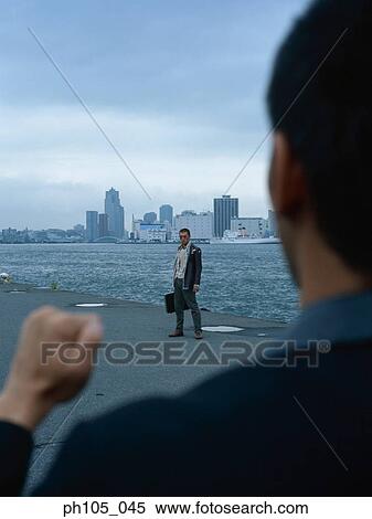 Stock Photography - Two men getting ready to fight. Fotosearch