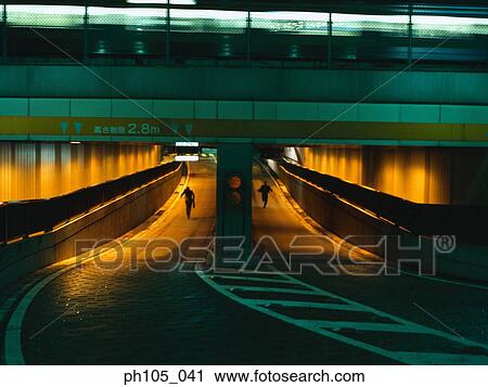 Two men running in a tunnel View Large Photo Image Stock Image - Two men running in a tunnel. Fotosearch