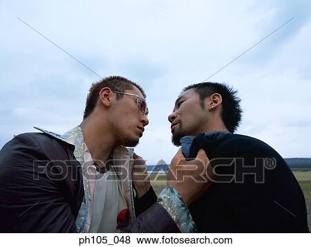 Two men struggling, low angle view View Large Photo Image Stock Photo - Two men struggling, low angle view. Fotosearch