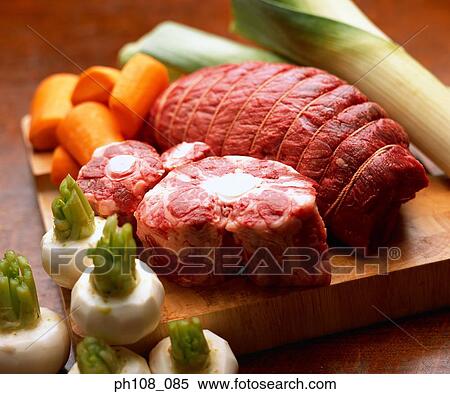 Stock Photography - Beef and vegetables on chopping board. Fotosearch