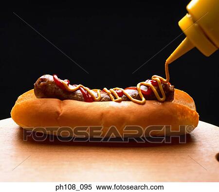 Custard sauce on sausage bun View Large Photo Image Stock Photography - Custard sauce on sausage bun. Fotosearch