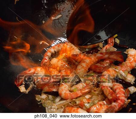 Stock Image - Fried prawns in wok. Fotosearch