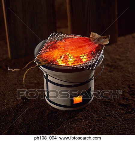Grilled cuttlefish over charcoal fire View Large Photo Image Picture - Grilled cuttlefish over charcoal fire. Fotosearch