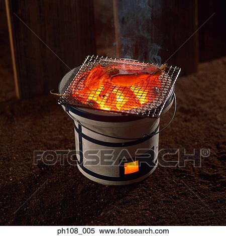 Grilled cuttlefish over charcoal fire View Large Photo Image Stock Photography - Grilled cuttlefish over charcoal fire. Fotosearch