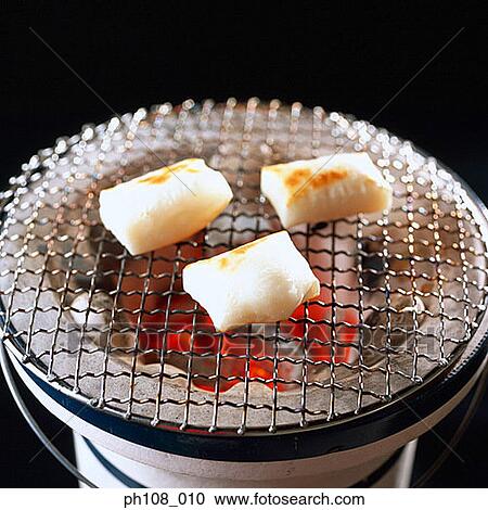 Grilled fishcakes over charcoal fire View Large Photo Image Stock Image - Grilled fishcakes over charcoal fire. Fotosearch
