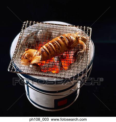 Grilled squid over charcoal fire View Large Photo Image Stock Image - Grilled squid over charcoal fire. Fotosearch