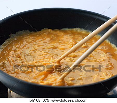 Stock Photography - Omelet on pan. Fotosearch