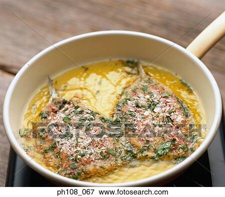 Pan fried fish View Large Photo Image Stock Photo - Pan fried fish. Fotosearch