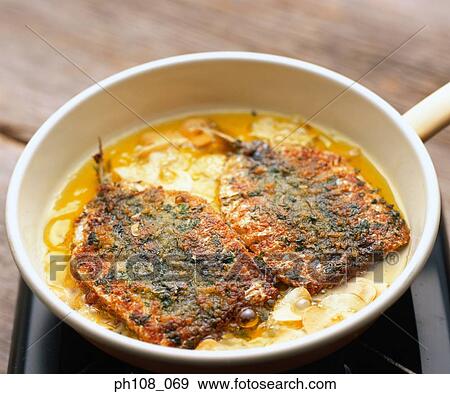 Stock Photo - Pan fried fish. Fotosearch