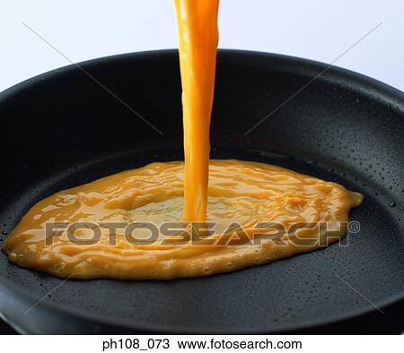 Pouring beaten eggs on pan View Large Photo Image Stock Image - Pouring beaten eggs on pan. Fotosearch