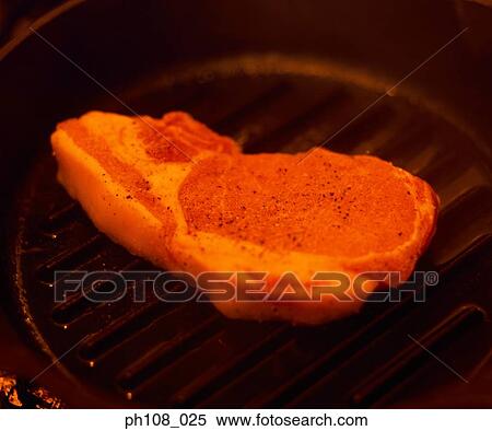 Raw pork chop on pan View Large Photo Image Stock Photography - Raw pork chop on pan. Fotosearch