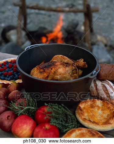 Roasted chicken in pot, garnish and pastry on table View Large Photo Image Stock Image - Roasted chicken in pot, garnish and pastry on table. Fotosearch