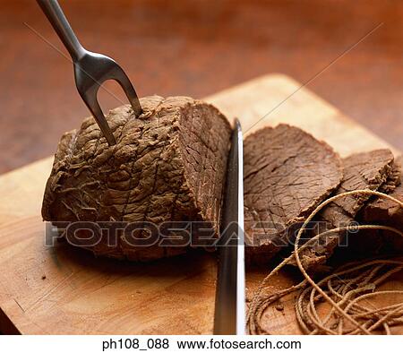 Slicing beef into slices View Large Photo Image Stock Photo - Slicing beef into slices. Fotosearch