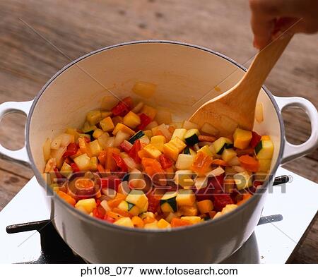 Stock Photo - Stirring mixed vegetables. Fotosearch