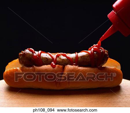 Tomato sauce on sausage bun View Large Photo Image Picture - Tomato sauce on sausage bun. Fotosearch