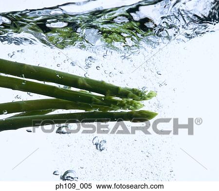 Stock Photography - Asparagus in boiling water. Fotosearch