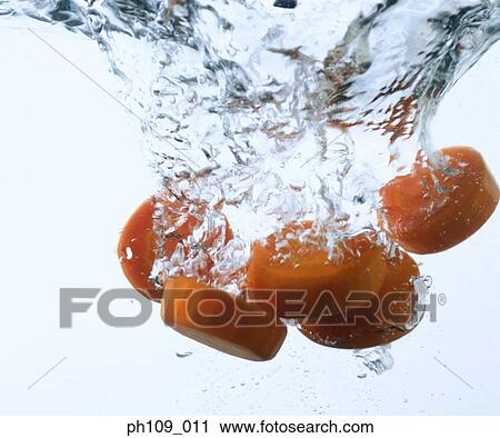 Carrot slices in boiling water View Large Photo Image Stock Image - Carrot slices in boiling water. Fotosearch