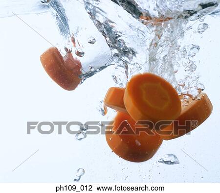 Carrot slices in boiling water View Large Photo Image Stock Image - Carrot slices in boiling water. Fotosearch
