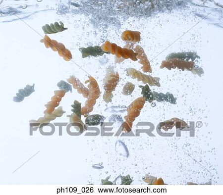 Stock Photograph - Corkscrew pasta in boiling water. Fotosearch