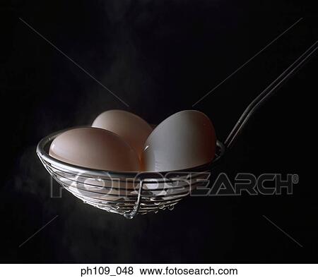 Egg in colander, steam View Large Photo Image Stock Photo - Egg in colander, steam . Fotosearch