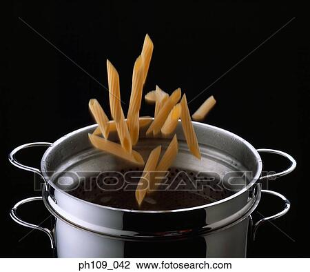 Stock Image - Mostaccioli falling into pot. Fotosearch
