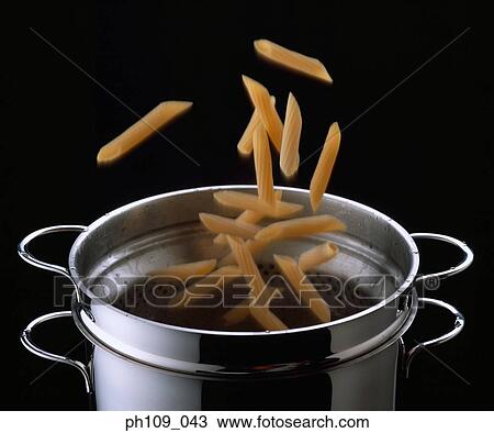 Mostaccioli falling into pot View Large Photo Image Stock Image - Mostaccioli falling into pot. Fotosearch