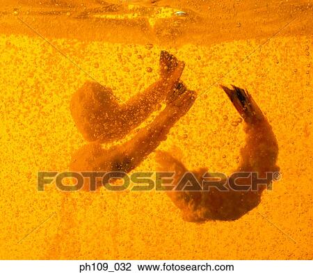 Prawns in boiling oil View Large Photo Image Stock Image - Prawns in boiling oil. Fotosearch