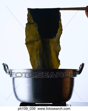 Removing seaweed from pot View Large Photo Image Stock Photo - Removing seaweed from pot. Fotosearch