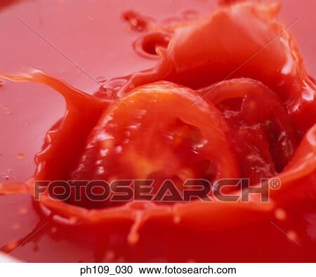 Tomato slices in tomato paste View Large Photo Image Stock Image - Tomato slices in tomato paste. Fotosearch