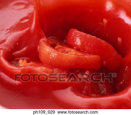 Stock Photo - Tomato slices in tomato paste. Fotosearch
