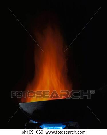 Wok on fire View Large Photo Image Stock Photo - Wok on fire. Fotosearch