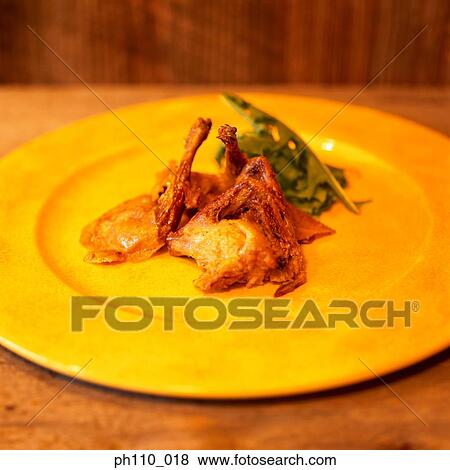 Chicken dish on yellow plate View Large Photo Image Stock Photo - Chicken dish on yellow plate. Fotosearch