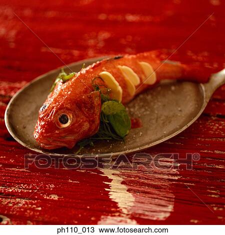 Stock Image - Marinated fish on plate. Fotosearch