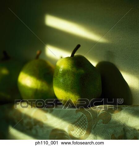 Stock Image - Sunlight on pears. Fotosearch