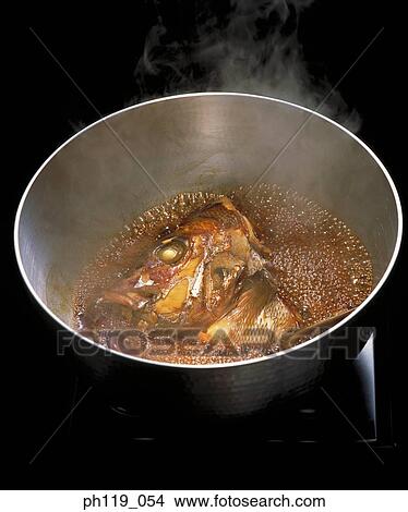 Boiling fish head in pot View Large Photo Image Picture - Boiling fish head in pot. Fotosearch