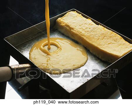 Pouring omelette in a pan View Large Photo Image Stock Image - Pouring omelette in a pan. Fotosearch