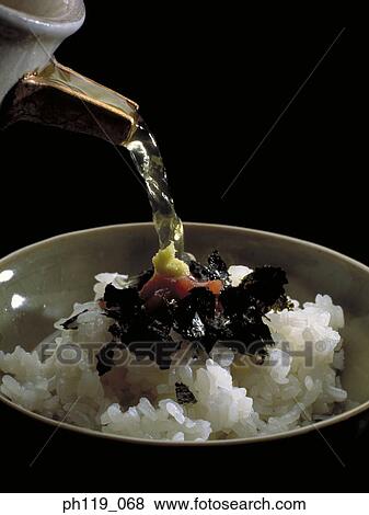 Pouring soup on a bowl of rice View Large Photo Image Stock Photo - Pouring soup on a bowl of rice. Fotosearch