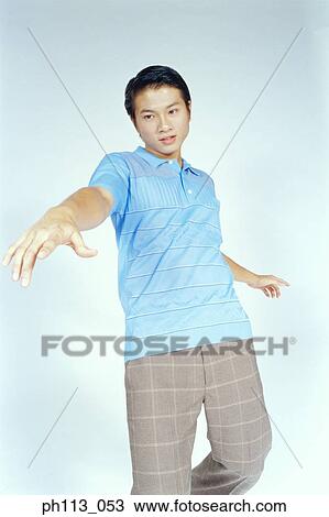 Man in polka stripes shirt, posing View Large Photo Image Stock Image - Man in polka stripes shirt, posing. Fotosearch