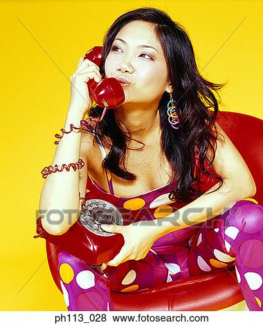 Young woman kissing handset, profile View Large Photo Image Stock Photo - Young woman kissing handset, profile . Fotosearch