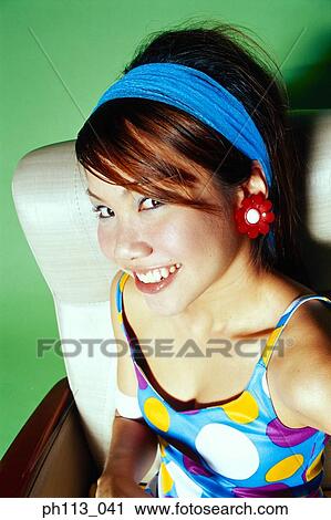 Young woman smiling, portrait View Large Photo Image Stock Image - Young woman smiling, portrait . Fotosearch