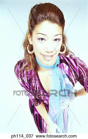 Stock Photo - Portrait of a young woman posing. Fotosearch