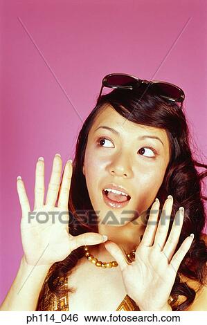 Young woman eavesdropping, close-up View Large Photo Image Stock Photograph - Young woman eavesdropping, close-up. Fotosearch