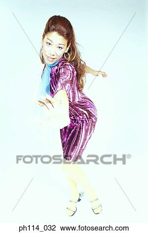 Young woman in dancing pose View Large Photo Image Stock Image - Young woman in dancing pose. Fotosearch